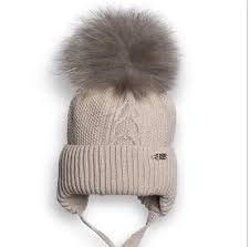 Wintermuts - binnenkant stof - met grote pompon - Beige